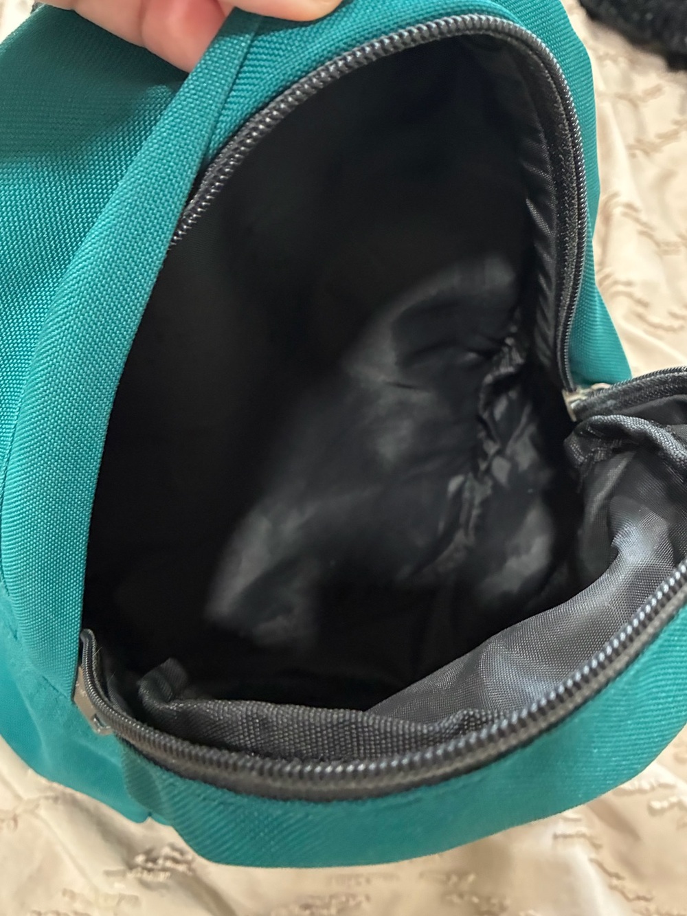 Carhartt teal Mini Backpack front zippered pocket. - Picture 4 of 6